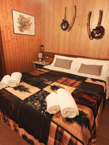 a bedroom with a bed with towels on it at Borda Cucut-HUT4-08181 in La Massana