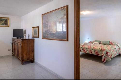 En eller flere senge i et værelse på Appartamento Villa Barbara Sardinia