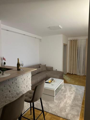 a living room with a couch and a table at Cetral032 in Čačak