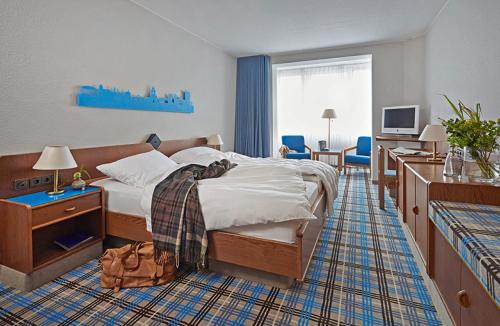 Postel nebo postele na pokoji v ubytování Seaside Residenz Hotel Chemnitz