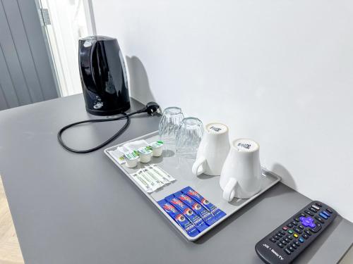 Příslušenství pro přípravu čaje a kávy v ubytování Old Ridgeway Hotel