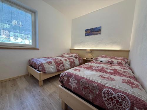 En eller flere senge i et værelse på Mountain Breeze