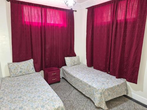 En eller flere senge i et værelse på Villa avec Piscine Meknes