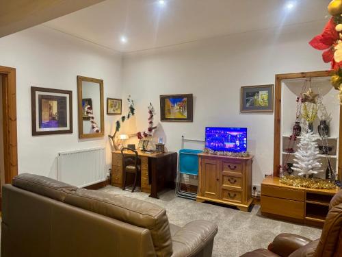 Een TV en/of entertainmentcenter bij 4B Millhill Street
