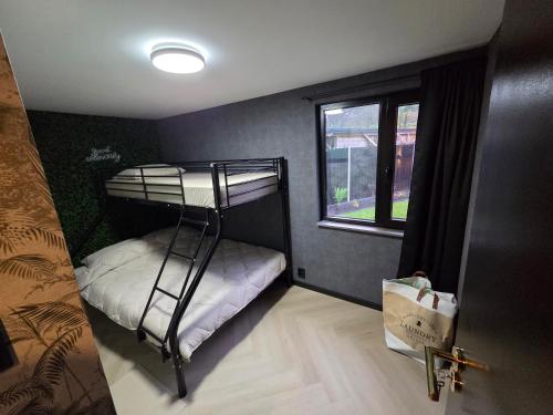 En eller flere senge i et værelse på Woodland Wellness Resort