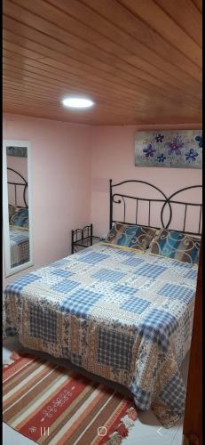 a bedroom with a large bed in a room at Casa da Tita in Peña de Folenche