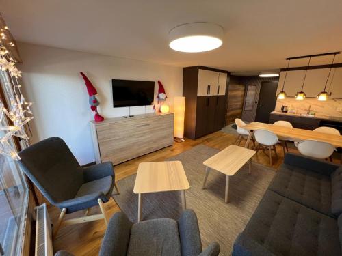 TV a/nebo společenská místnost v ubytování Cosy studio for 5 near ski lift, HAMEAU D2