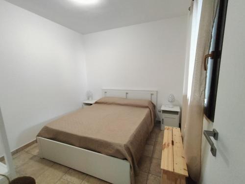 a bedroom with a bed in a white room at SalMar Campomarino in Campomarino