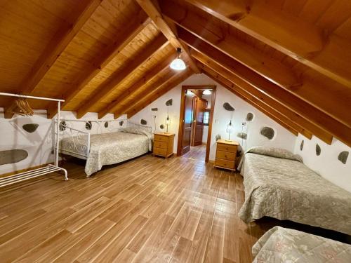 En eller flere senge i et værelse på Casa Naranjo