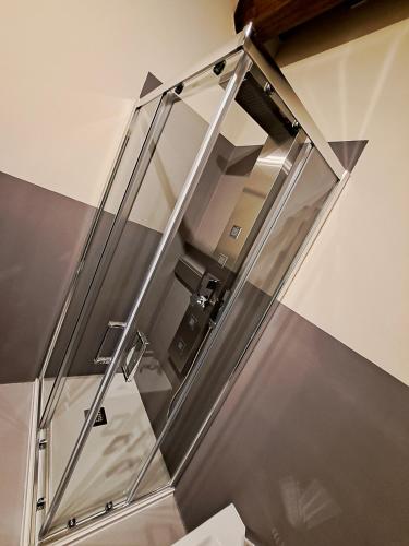 a glass shower door in a bathroom at IL MOLINO del SIGNORE in Pergola