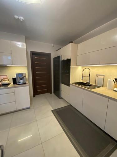 Kuchyň nebo kuchyňský kout v ubytování Victoria Domek do wynajecia