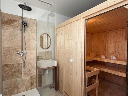 a bathroom with a shower and a sink at Domaine Les Pigées in Saint-Privé