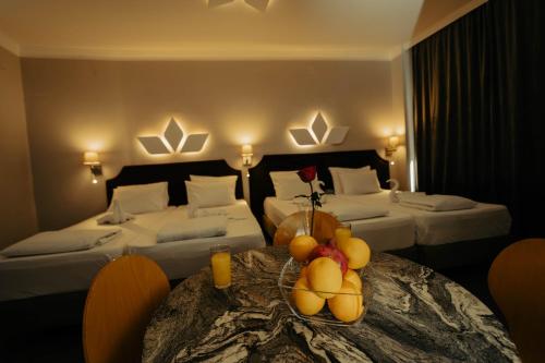 En eller flere senge i et værelse på H Apartman Požarevac