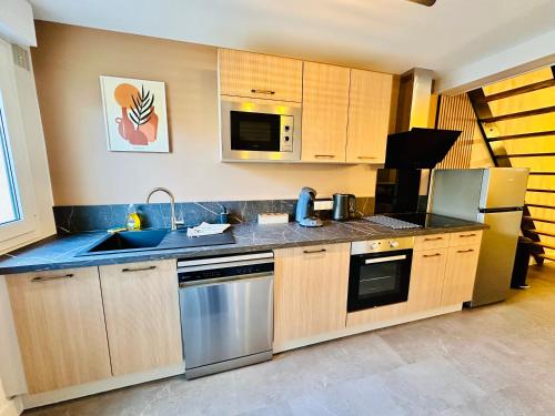 Kuchyň nebo kuchyňský kout v ubytování Maison avec Jardin 6 Couchages & Parking gratuit à proximité du Futuroscope