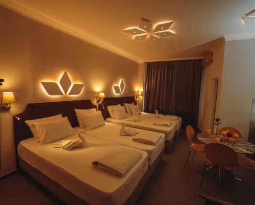 En eller flere senge i et værelse på H Apartman Požarevac