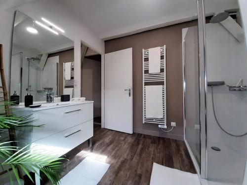 a bathroom with a shower and a sink at O paradis in Beaune