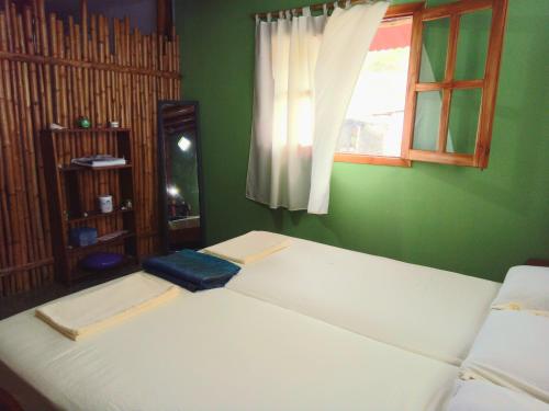 Ένα ή περισσότερα κρεβάτια σε δωμάτιο στο Casa Almavida