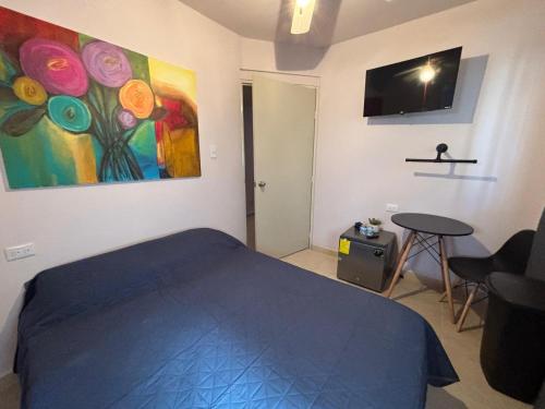 Et tv og/eller underholdning på 3 Apartamento cerca de Consulado USA