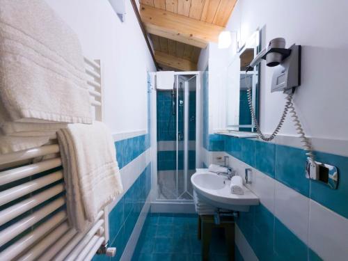 a bathroom with a sink and a mirror at IL Postale in Castel di Sangro