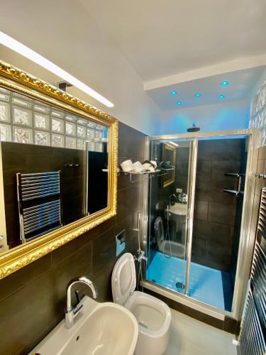 a bathroom with a toilet and a sink and a shower at Giovanni Rooms Manarola in Manarola