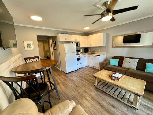 a living room with a couch and a table at Seaside 155 in Hilton Head Island