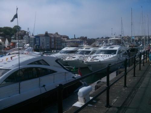 a bunch of boats docked in a harbor at Cavendish House in Weymouth