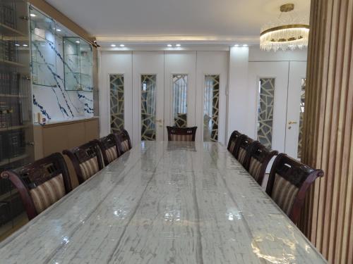 a long table in a conference room with chairs at Gedera Rental in Gedera