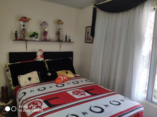 En eller flere senge i et værelse på Casa Confortável , espaçosa, proximo da praia