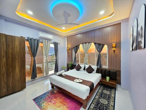 a bedroom with a large bed and a window at ll EMPYREAN STAYS ll G0DFATHER VILLA ll MASTERPIECE ll 4BHK ll AC ll LARGEST POOL ll in Lonavala