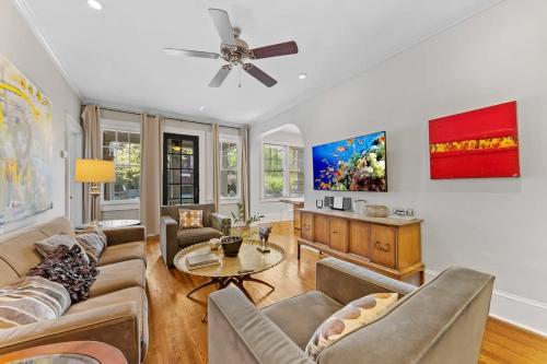 a living room with a couch and a table at The Home Collection CLT: 500 Queens in Charlotte