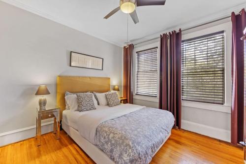 a bedroom with a bed and a ceiling fan at The Home Collection CLT: 500 Queens in Charlotte