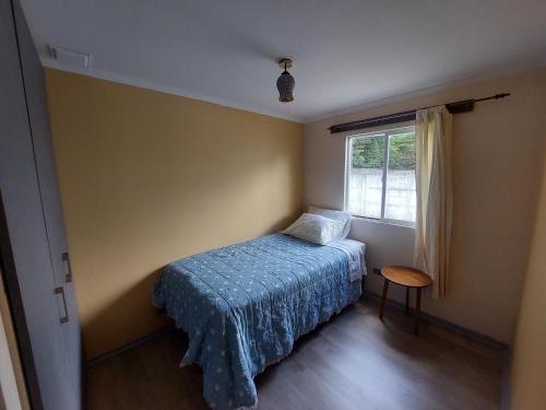 Giường trong phòng chung tại Hostal House FloVer