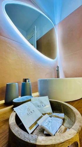 a room with a table with books and a mirror at Ada&niní in Galatina