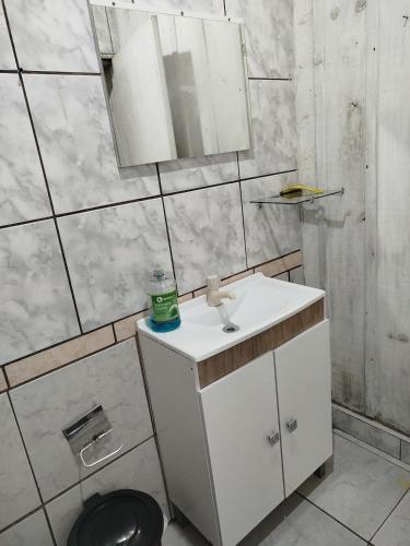 a bathroom with a sink and a toilet at Chácara Betel in Rancho Queimado