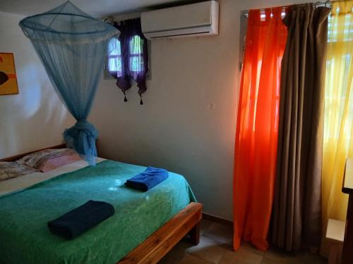 Postel nebo postele na pokoji v ubytování Le Jardin de Massieux