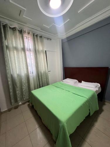 Llit o llits en una habitació de Fadilimmo 009