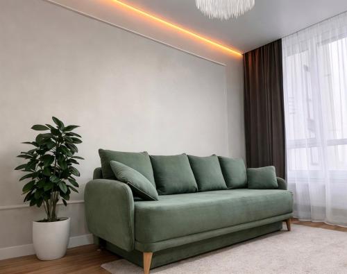 Een zitgedeelte bij New Business-Class Apartament з генератором Varshavsky Retroville