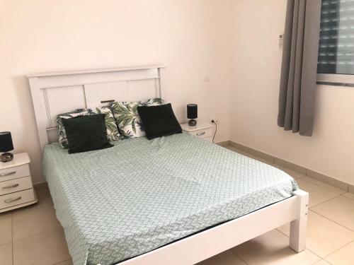 En eller flere senge i et værelse på Casa Dimaria