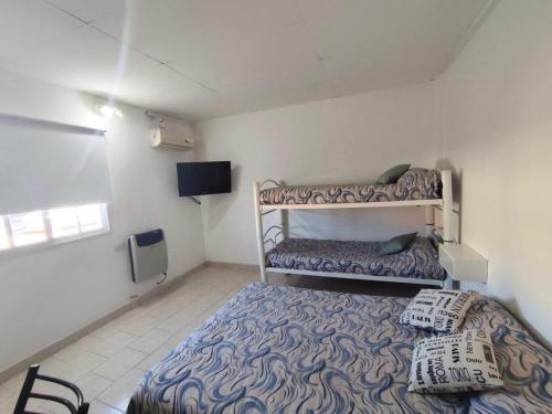 En eller flere senge i et værelse på Gotas de Rocio N1