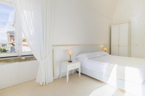 Postel nebo postele na pokoji v ubytování Dimora Margherita