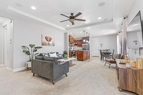a living room with a couch and a ceiling fan at Sensible Safari Sleeps 10 in Meridian