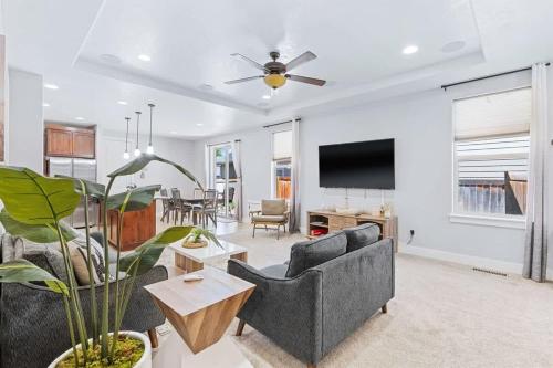 a living room with two couches and a tv at Sensible Safari Sleeps 10 in Meridian