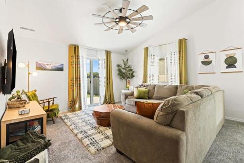 a living room with a couch and a table at Caldwell Ruby Tuesday! 60's Inspired comfort 3B2B in Caldwell
