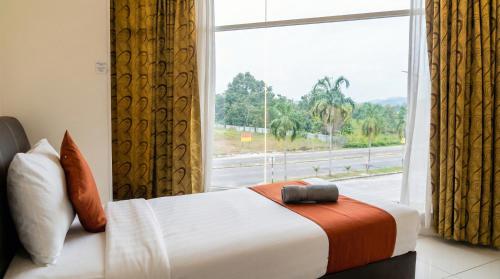 En eller flere senge i et værelse på Hotel Double Star Klia