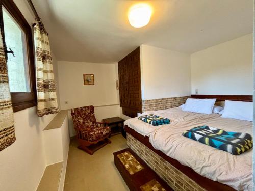 En eller flere senge i et værelse på Casa Estrella