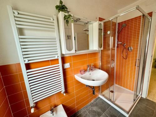 a bathroom with a sink and a shower at ARIEL'S house in San Benedetto del Tronto