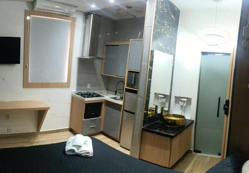 Køkken eller tekøkken på Studio moderno no centro de São Lourenço Avenida Principal