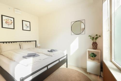 En eller flere senge i et værelse på Elegant 1-Bed Apt in City Centre