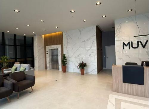 Et opholdsområde på Lindo Loft Studio no Centro de Curitiba