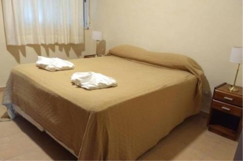 En eller flere senge i et værelse på Hotel vacacional Sierras de cordoba